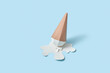 © Yaroslav Danylchenko/Stocksy - Papercraft ice cream cone in a paper puddle.