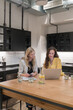 © Hernandez & Sorokina/Stocksy - Two Women Working At Kitchen