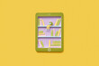 © Yaroslav Danylchenko/Stocksy - Paper screen of e-book with educational library.