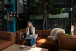 © Hernandez & Sorokina/Stocksy - Entrepreneur Woman Working In A Lobby