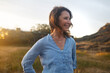 © Rob and Julia Campbell/Stocksy - Confident, content mature woman portrait at sunset
