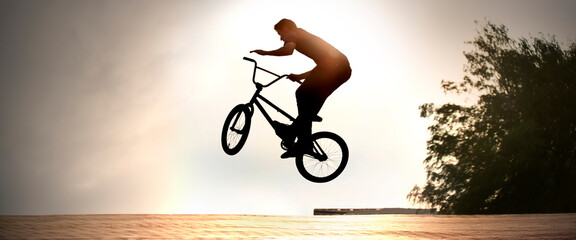 teenager jump on a bicycle outdoors