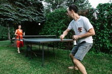 Table Tennis Match In Garden