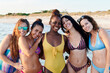 © Ivan Gener/Stocksy - Friends in swimwear enjoying a day at the beach