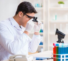 Young chemical scientist working in lab