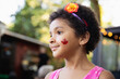 © absphotography/Stocksy - Portrait of a smiling pretty mixed child with a Canada maple leaf tattoo on her face,