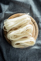 Sticker - Dried white rice noodles. Raw pasta. Uncooked noodles.