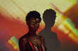 © MyMicrostock/Stocksy - Black african woman posing in the studio with colorful lights