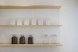 © Jeremiah Le/Stocksy - Coffee Bean Jar and Coffee Bag on a shelf