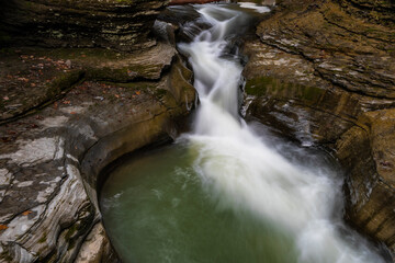 Wall Mural - USA, New York, Watkins Glen. Waterfall cascade over rock.