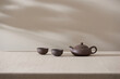 © Maki Company Limited/Stocksy - clay teapot for the tea ceremony. there are 2 ceramic tea files on the stand