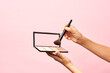 © 365mm/Stocksy - Crop person taking concealer from palette