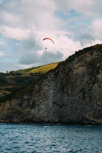Paraglider Over The Cliffs Of Laredo