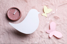 Flat Lay Composition With Bird Shaped Child's Night Lamp On Pink Fabric