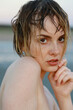 © Amsterdam/Stocksy - portrait of young woman with wet hair