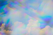 Prism Against Fluffy Clouds In Sky