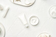 © 365mm/Stocksy - Containers with cream near skin care supplies