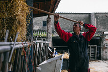 Male Farmer Working In Barn