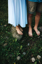 Girl And Boy With Bare And Dirty Feet