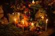 © Mark Pollard/Stocksy - Small Skeleton Dolls Adorn a Family Grave