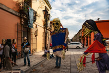 Lively Street Performers With Paper Mache Masks