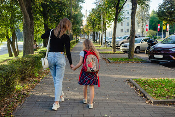 preschool girl walk with her mother