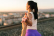© Mihajlo Ckovric/Stocksy - Outdoor yoga on the roof