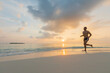 © Felix Hug/Stocksy - Man running barefeet on a Maldivian beach