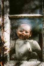 Slightly Creepy Baby Doll At A Window