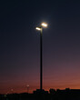 © Haley Lan/Stocksy - light pole during sunset