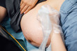 © MaaHoo Studio/Stocksy - Doctor performing ultrasound on pregnant woman