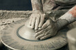 © Floris Productions/Stocksy - Ceramist, man's hands working on clay