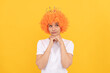 © Olena - egoistic funny girl with fancy look wearing orange hair wig and princess crown, imagining