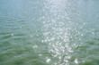 © Jeremiah Le/Stocksy - Sparkling sunlight on the watery lake surface