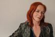 © Liliya Rodnikova/Stocksy - Headshot portrait of mature redhead woman