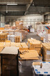 © Jelena Jojic Tomic/Stocksy - A small warehouse packed with a carload ready for distribution