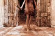 © Don Smith/Stocksy - Scary girl with meat cleaver chasing in old hallway
