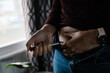 © Samantha Gehrmann/Stocksy - A woman self administers an injection