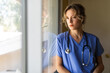 © McKinsey Jordan/Stocksy - Worried Nurse Observes Outside Life