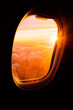 © Angela Lumsden/Stocksy - Sunrise through an airplane window