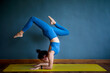 © stockphoto mania - woman doing yoga pose in home living room