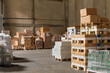 © Jelena Jojic Tomic/Stocksy - A small warehouse packed with a carload ready for distribution