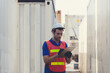 © nikomsolftwaer - Foreman of container inspection workers prepare export products. Container Shipping Logistics Engineering of Import Export Transportation Industry