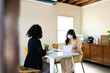 © McKinsey Jordan/Stocksy - Masked Female Entrepreneurs in an Office Space