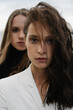 © Julie Meme/Stocksy - Sensual closeup portrait of two girls