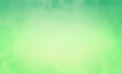 soft blurred green background in fresh spring and summer colors with blurry dark borders and light center color