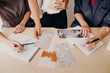 © Kristine Weilert/Stocksy - Creative Women Collaborating Around Desk