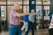 © VISUALSPECTRUM/Stocksy - Senior Citizens Exercising Together Indoors