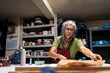 © Nunez Image/Stocksy - Woman Working in Pottery Workshop