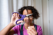 Girl Holds Scissors Ready To Cut Hair